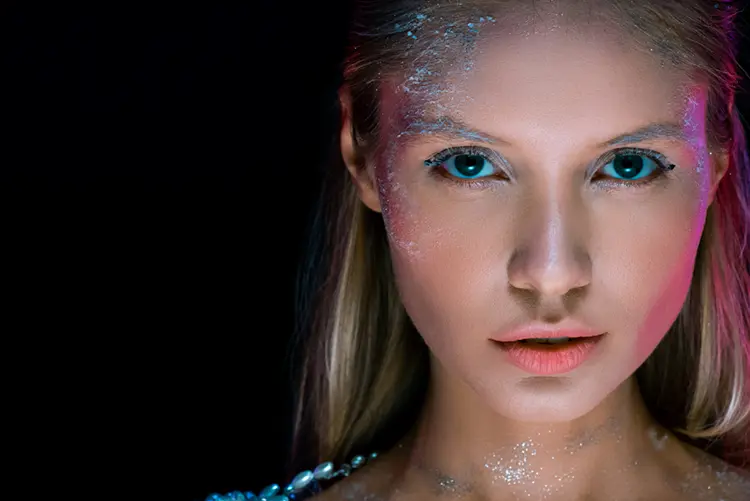 Y3K futuristic makeup — chrome metallic eyes and cool-tone graphic liner look